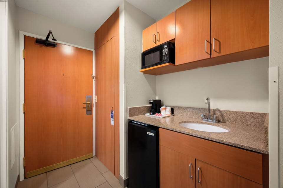 Suite, 1 King Bed with Sofa bed, Non Smoking | Private kitchen | Fridge, microwave, coffee/tea maker