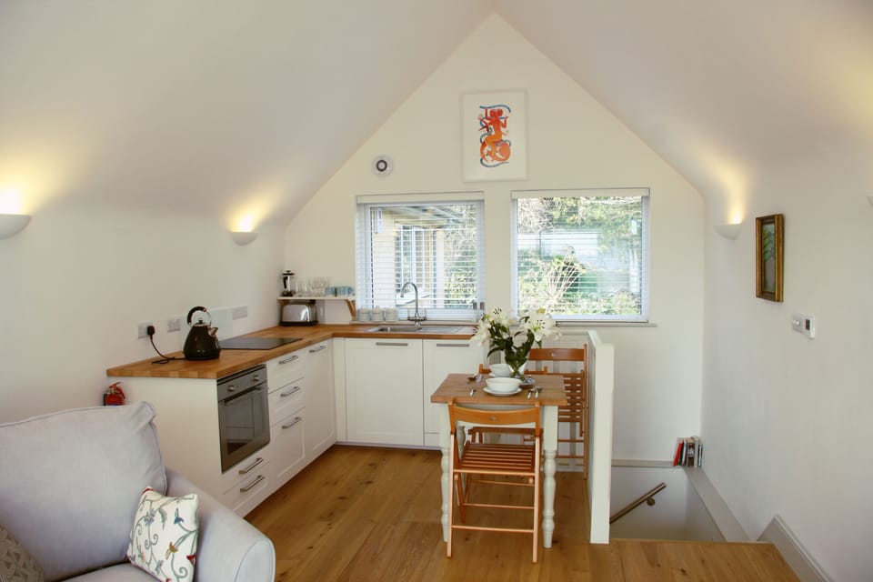 Studio | Desk, iron/ironing board, bed sheets