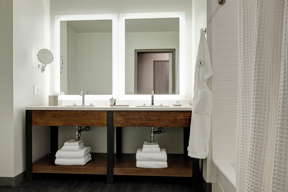 Designer toiletries, hair dryer, bathrobes, slippers