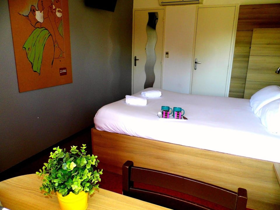 Premium bedding, desk, laptop workspace, iron/ironing board