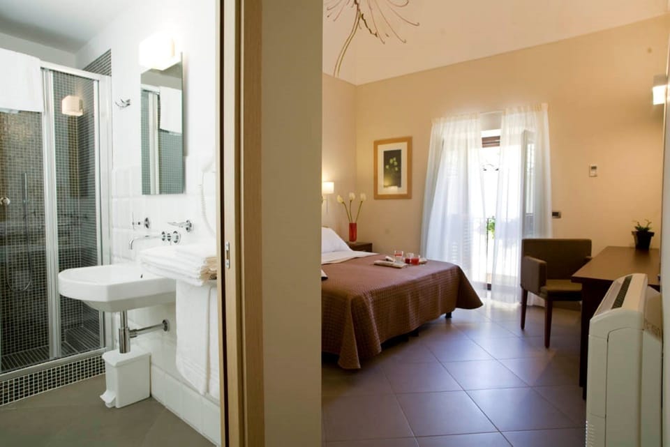 Double or Twin Room | Minibar, in-room safe, desk, blackout drapes