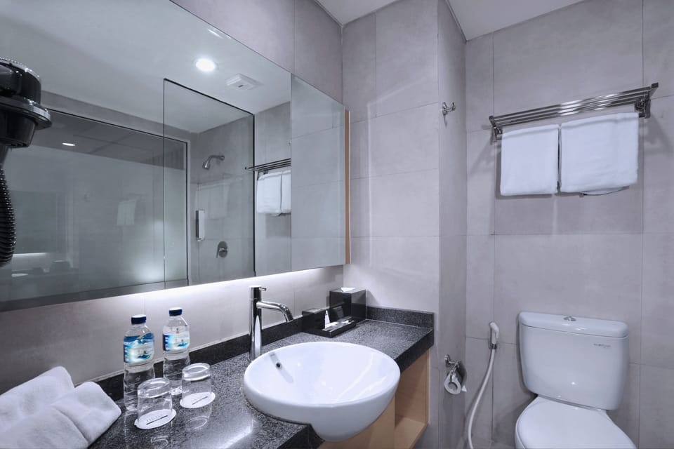 Shower, rainfall showerhead, slippers, towels
