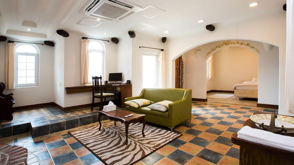 Romantic Room (Spa) | Living area | Flat-screen TV, fireplace, heated floors