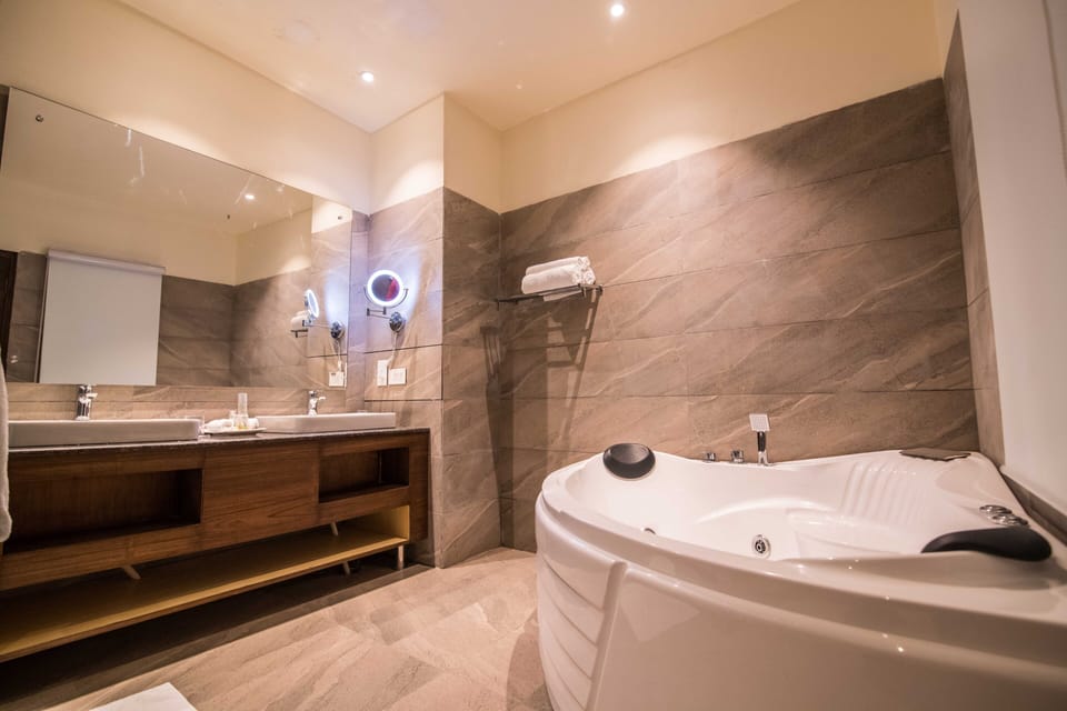 Shower, rainfall showerhead, designer toiletries, slippers