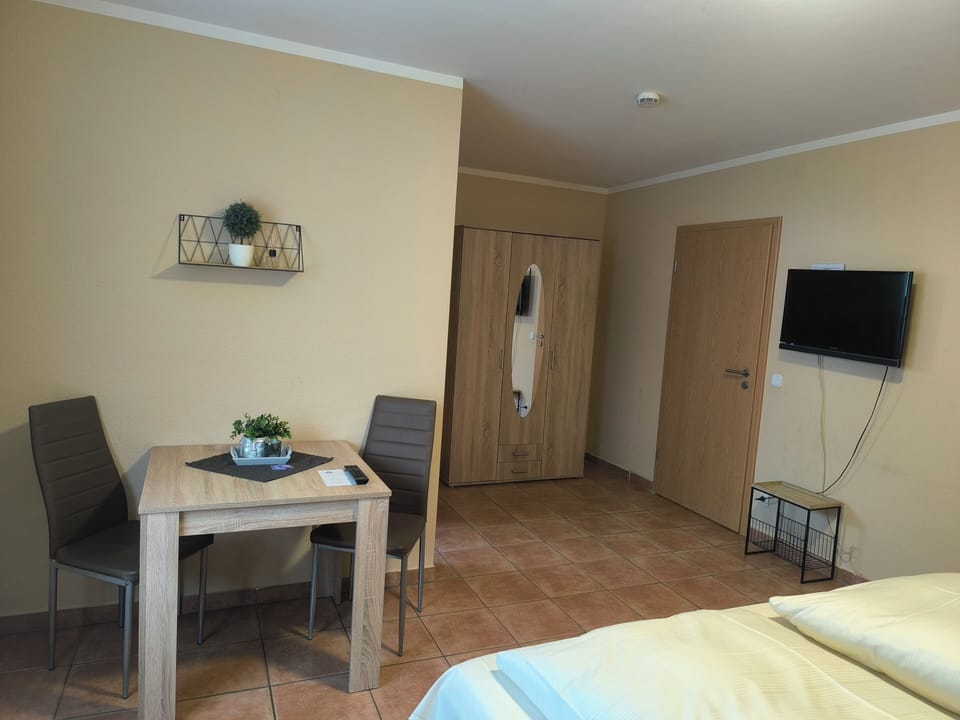 Triple Room | Living area | Flat-screen TV