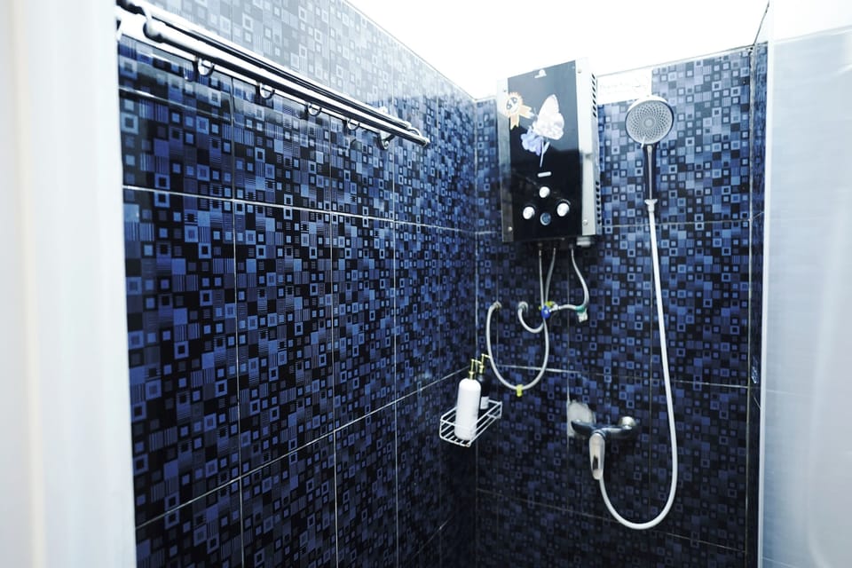 Family Room | Bathroom | Shower, rainfall showerhead, slippers, bidet
