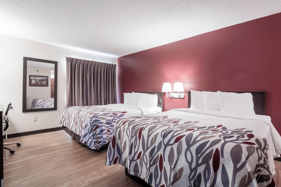 Suite, 2 Queen Beds, Non Smoking | Desk, laptop workspace, blackout drapes, iron/ironing board