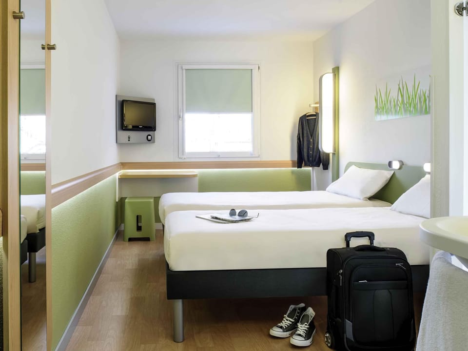 Desk, laptop workspace, free WiFi, bed sheets