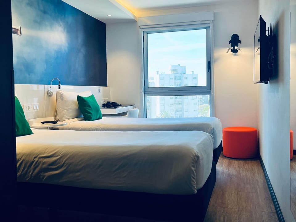 Standard Room, 2 Twin Beds | Minibar, in-room safe, desk, blackout drapes
