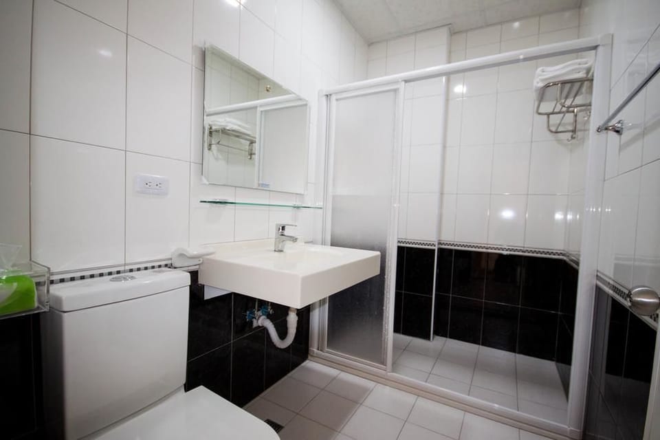 Shower, free toiletries, hair dryer, slippers