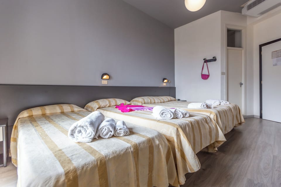 Standard Quadruple Room | In-room safe, desk, WiFi (free), bed sheets