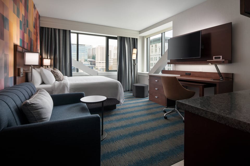 Premium bedding, pillowtop beds, desk, blackout drapes