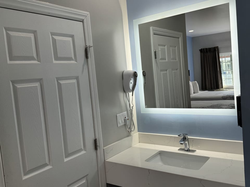 Standard Double Room, 2 Queen Beds | Bathroom | Combined shower/tub, hair dryer, towels