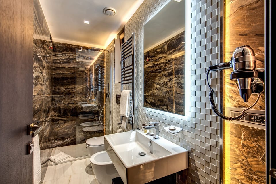 Deluxe Triple Room, City View | Premium bedding, minibar, in-room safe, desk