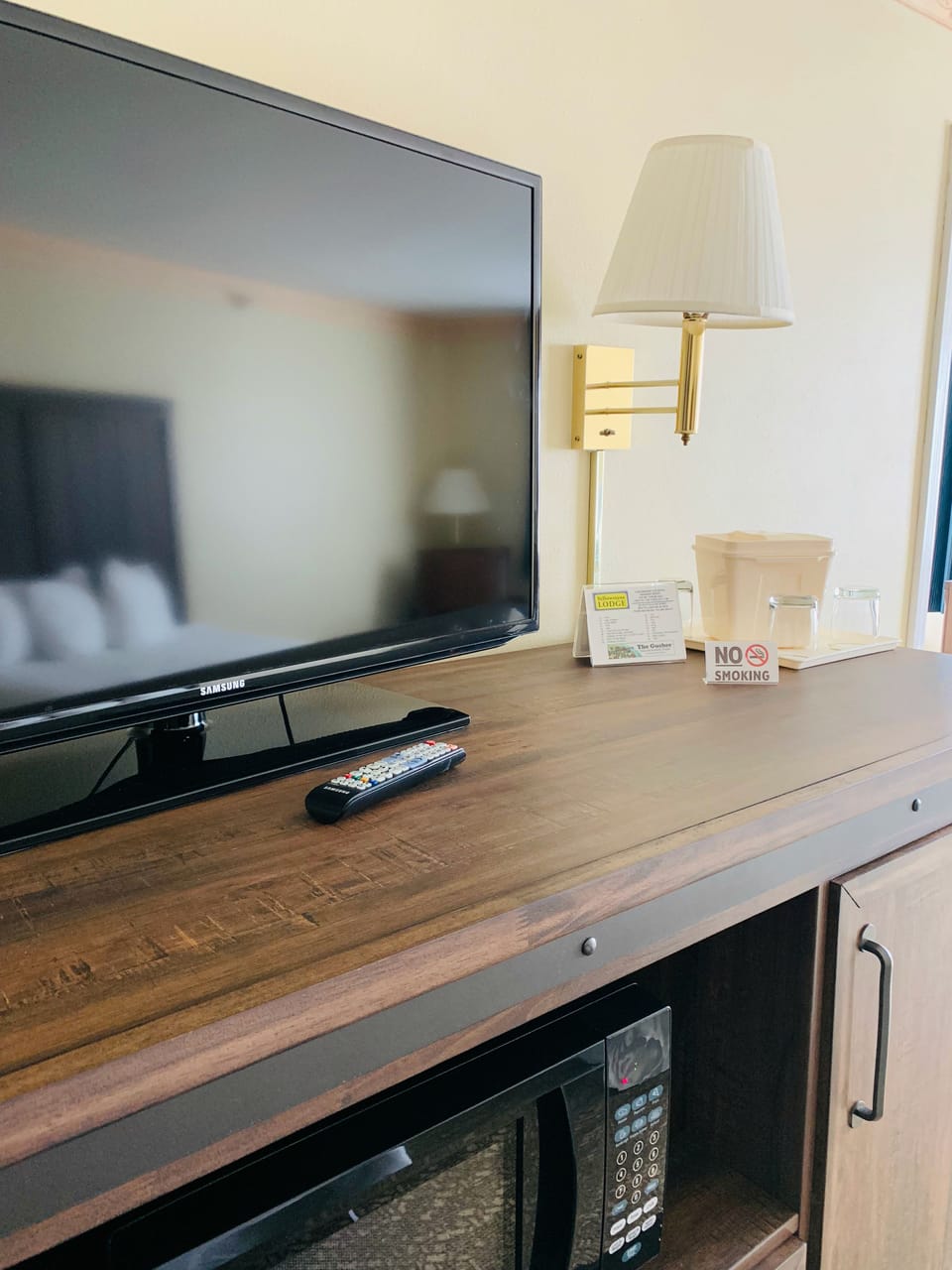 Desk, laptop workspace, blackout drapes, iron/ironing board