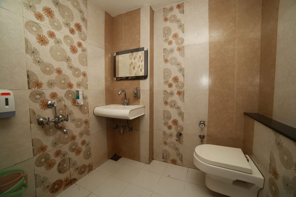 Family **Four** Bed A/C Room | Bathroom | Shower, rainfall showerhead, free toiletries, bidet