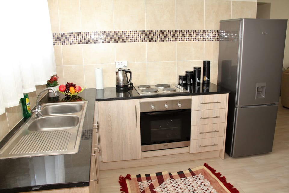 Family Apartment, Multiple Beds, Non Smoking, Garden View | Private kitchen | Fridge, microwave, oven, cookware/dishes/utensils