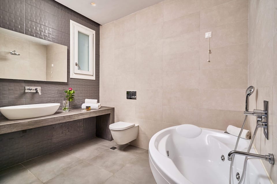 Villa, 2 Bedrooms, Sea View | Bathroom | Rainfall showerhead, designer toiletries, hair dryer, bathrobes
