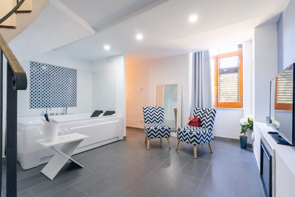 Romantic Room, Hot Tub | Living area | Flat-screen TV