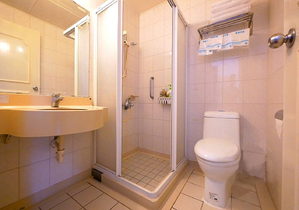 Shower, free toiletries, hair dryer, slippers