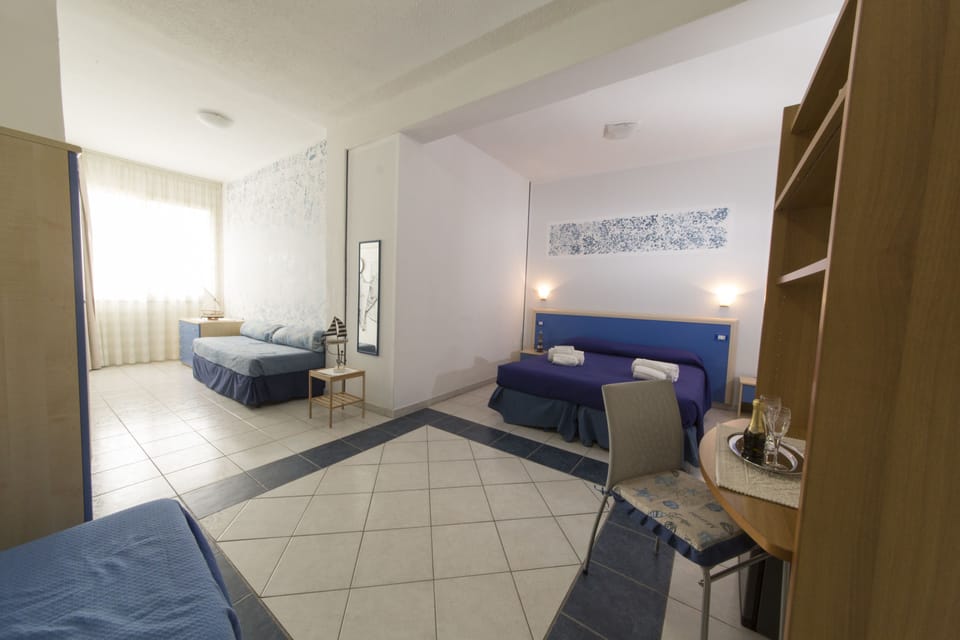 Quadruple Room | Desk, iron/ironing board, free WiFi, bed sheets