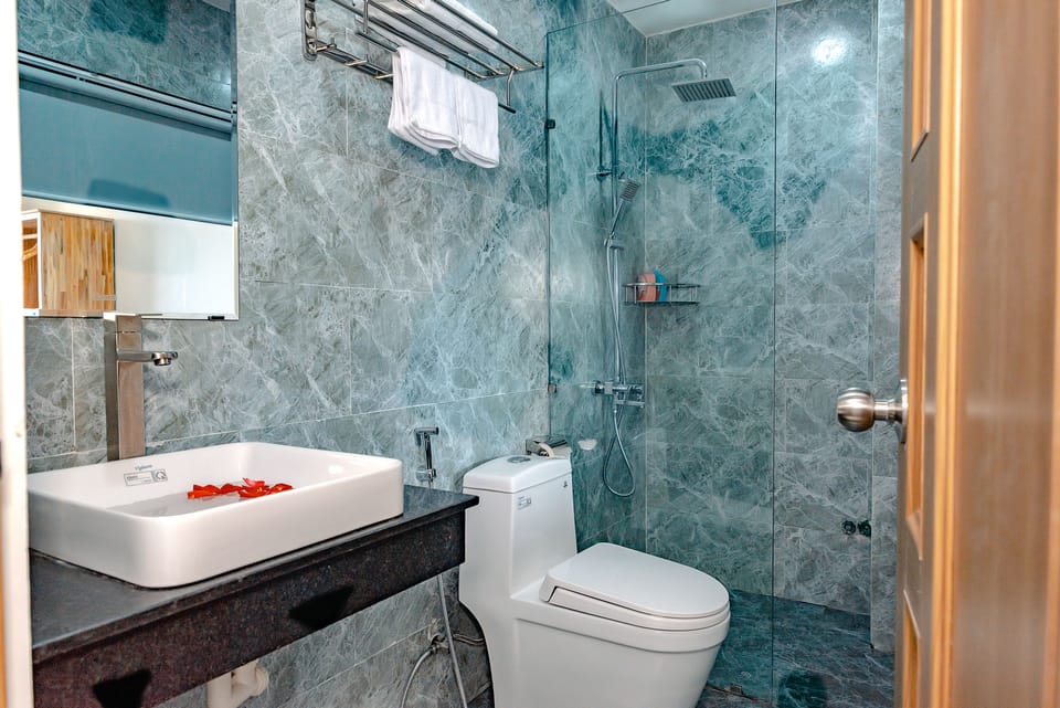 Shower, free toiletries, hair dryer, slippers