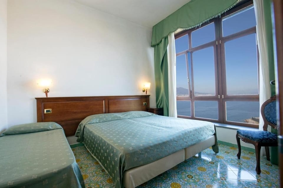 Superior Double or Twin Room, Sea View | Down comforters, minibar, in-room safe, desk
