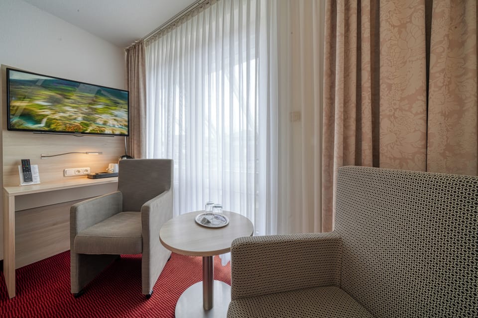 Superior Double Room | Minibar, in-room safe, desk, blackout drapes