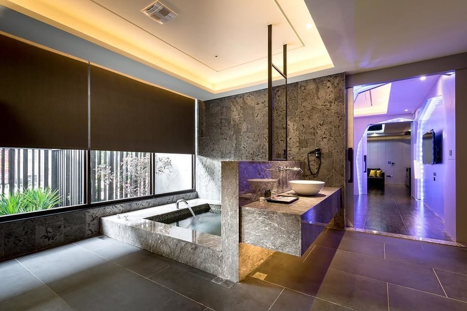 Party Suite (Consecutive night 11 pm check-out required) | Bathroom | Separate tub and shower, rainfall showerhead, hair dryer, slippers