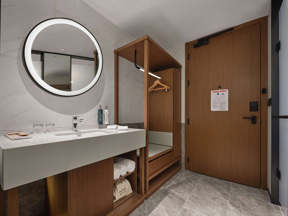 Shower, hair dryer, slippers, towels