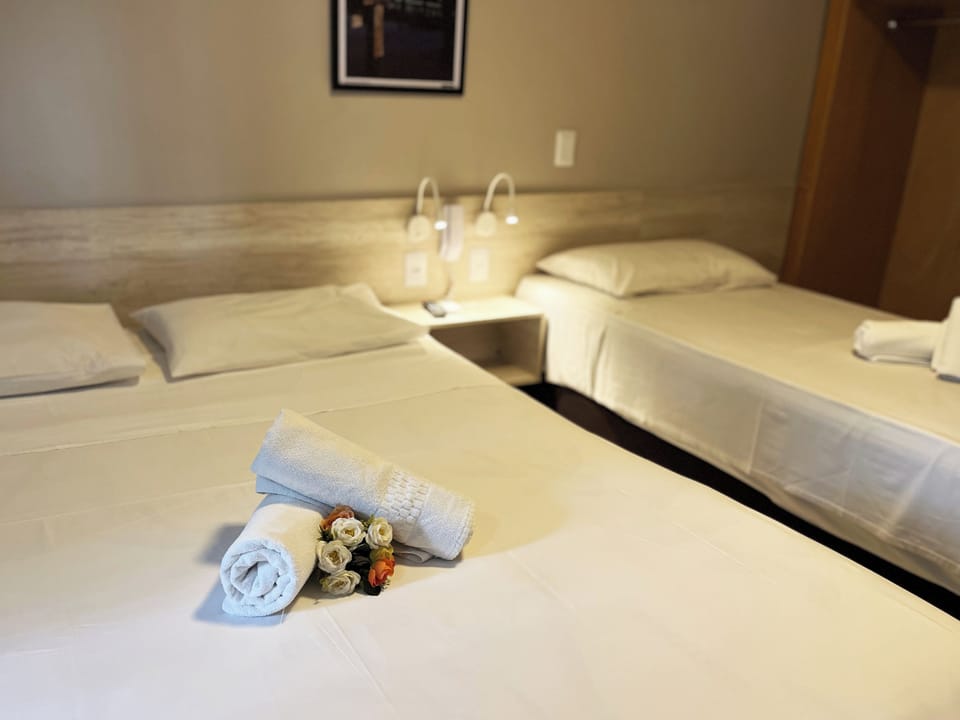 Deluxe Triple Room | Minibar, individually decorated, individually furnished, desk