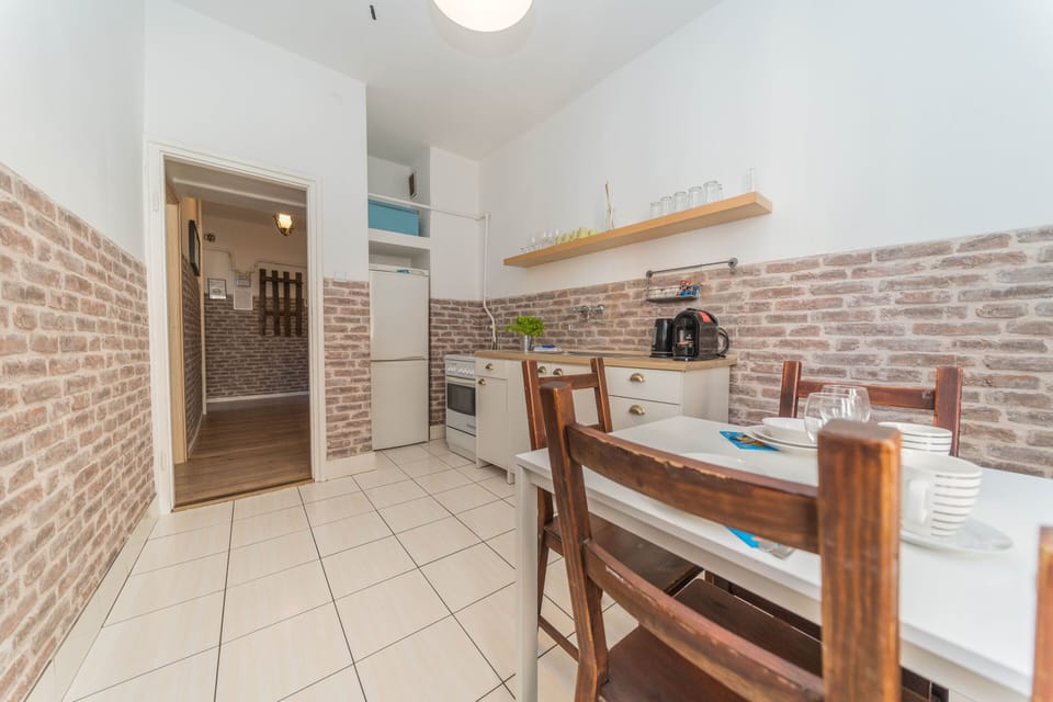 Comfort Apartment, 2 Bedrooms | Private kitchen | Full-size fridge, oven, stovetop, coffee/tea maker