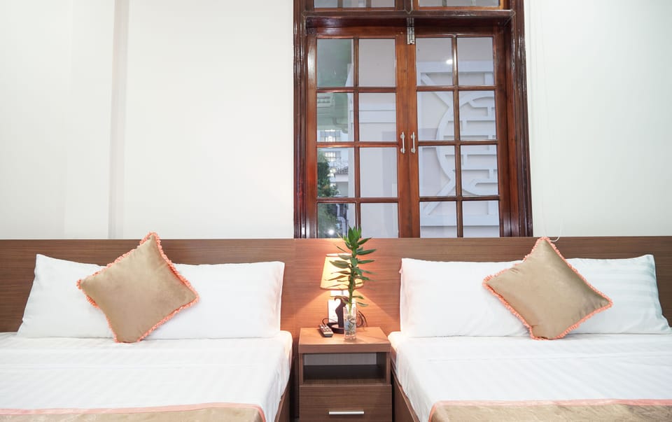 Deluxe Quadruple Room, 2 Double Beds | Minibar, desk, blackout drapes, soundproofing