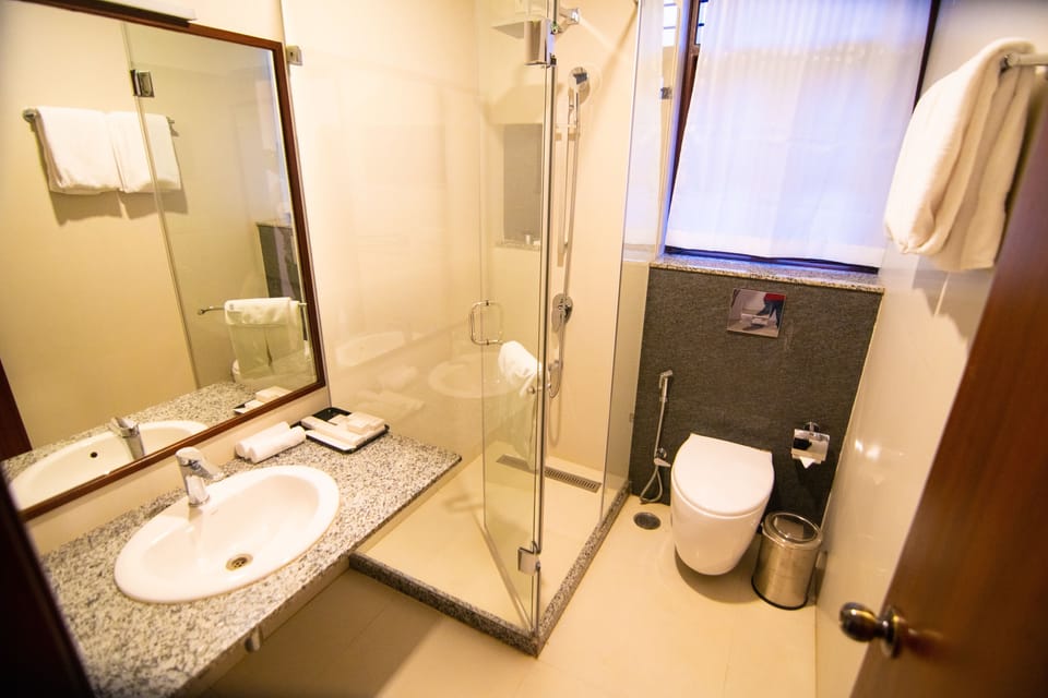 Shower, slippers, bidet, towels