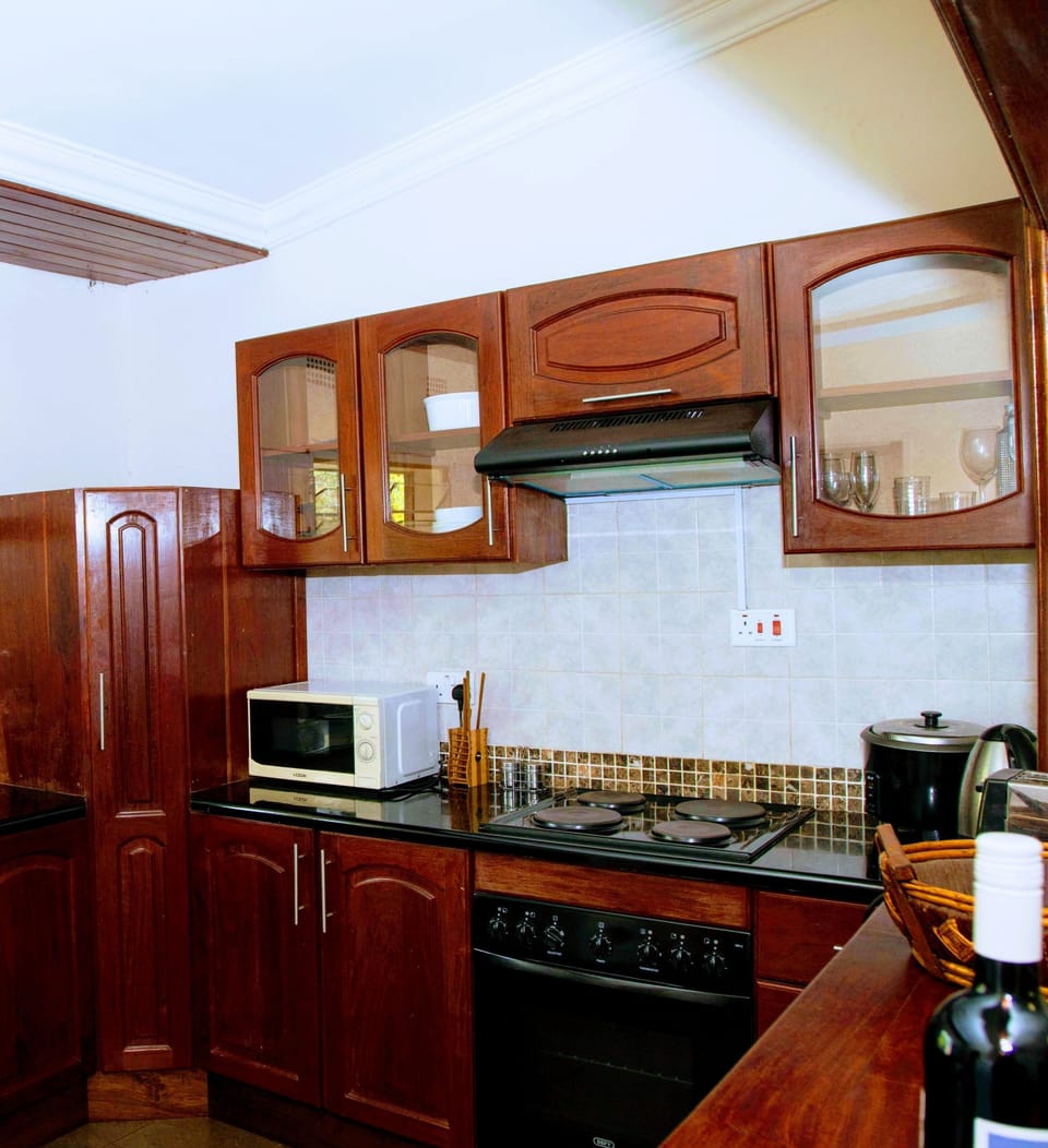 Premium Apartment, 2 Double Beds, Non Smoking, Garden View | Private kitchen | Fridge, microwave, oven, stovetop