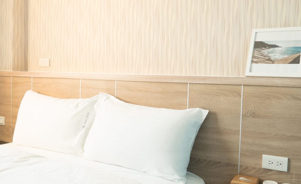 Premium bedding, desk, laptop workspace, blackout drapes