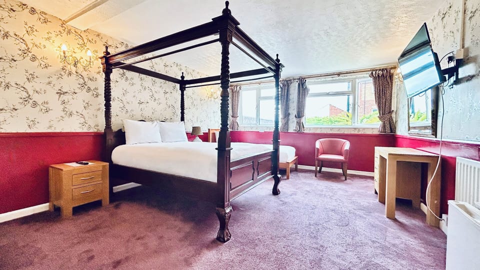 Deluxe Family Room | Down comforters, blackout drapes, free WiFi