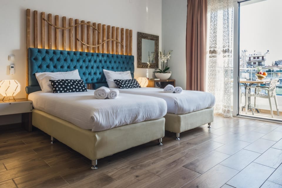 Triple Room, Balcony | In-room safe, laptop workspace, blackout drapes, soundproofing