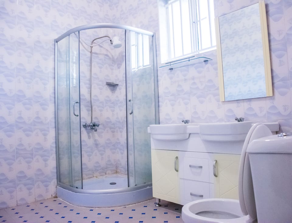Shower, rainfall showerhead, bathrobes, towels