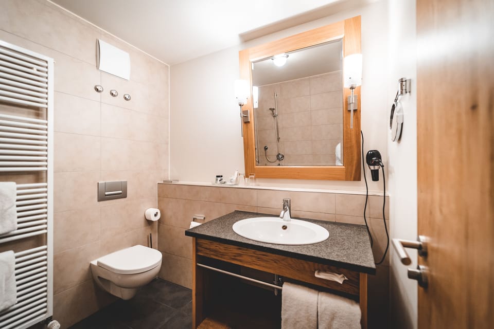 Shower, free toiletries, hair dryer, slippers