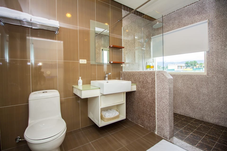 Deluxe Quadruple Room, 2 Double Beds, Non Smoking | Bathroom | Free toiletries, hair dryer, slippers, towels