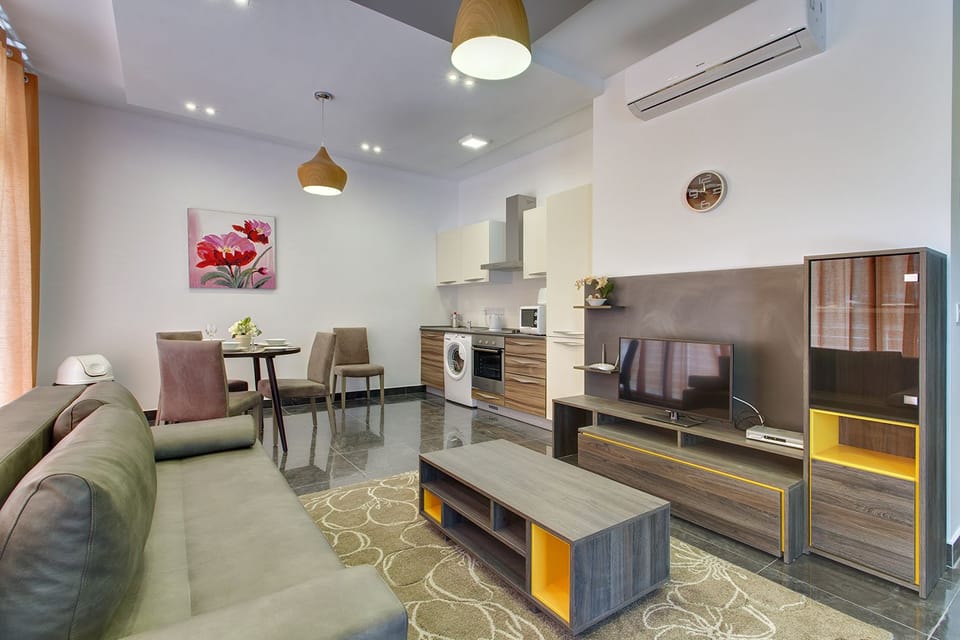 Apartment (1 Bedroom) | Living area | TV
