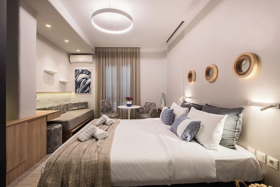 Triple Room, Partial Sea View | In-room safe, desk, blackout drapes, soundproofing