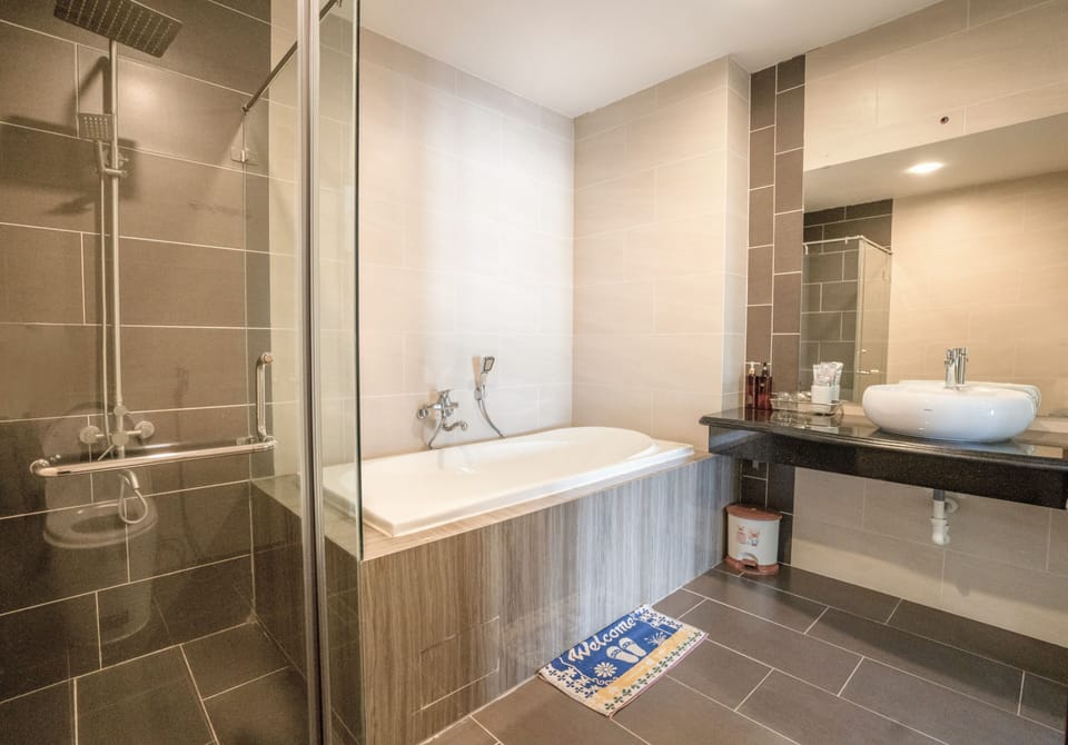 Family Room, 2 Queen Beds, Non Smoking, Balcony | Bathroom | Free toiletries, hair dryer, slippers, towels