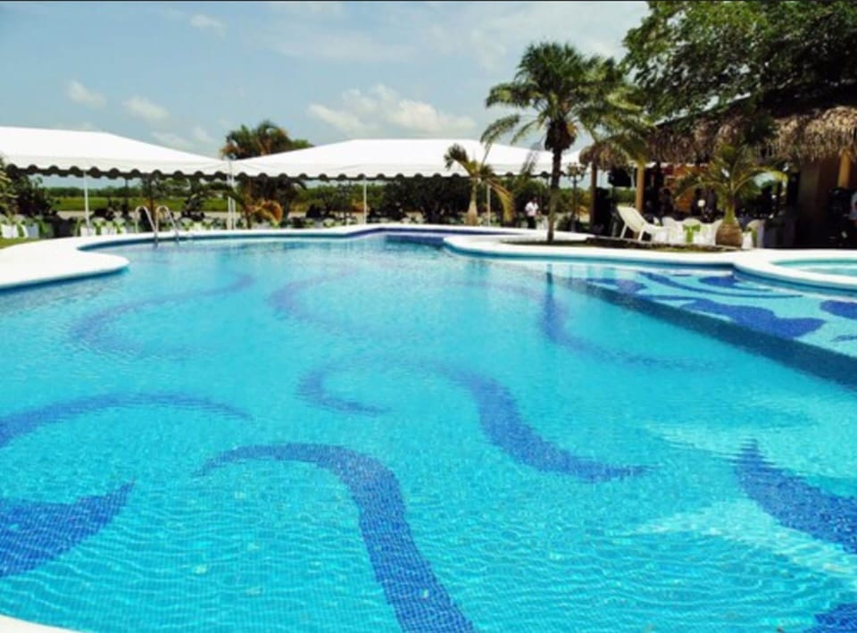 Outdoor pool, open 8:00 AM to 9:00 PM, pool umbrellas, sun loungers
