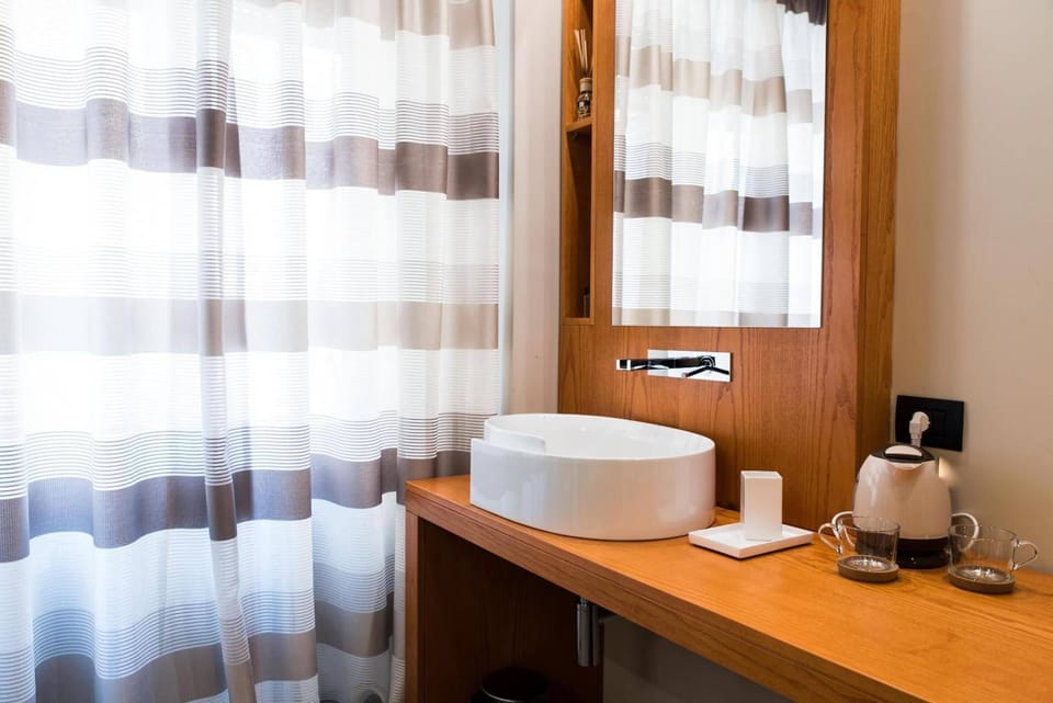 Shower, free toiletries, hair dryer, slippers