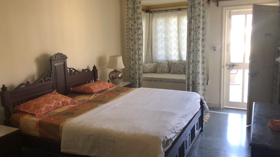 Deluxe Double Room, 1 King Bed, Hill View | 1 bedroom, minibar, individually decorated, individually furnished