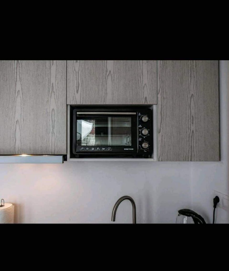 Deluxe Condo, Sea View | Private kitchenette | Full-size fridge, microwave, stovetop, coffee/tea maker