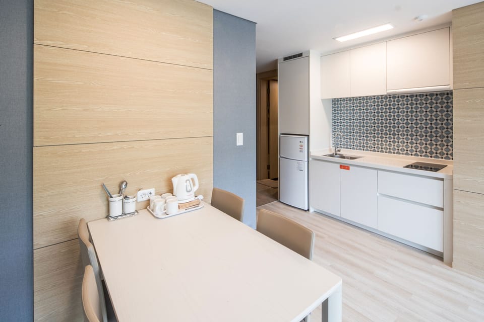 Fridge, microwave, electric kettle, dining tables