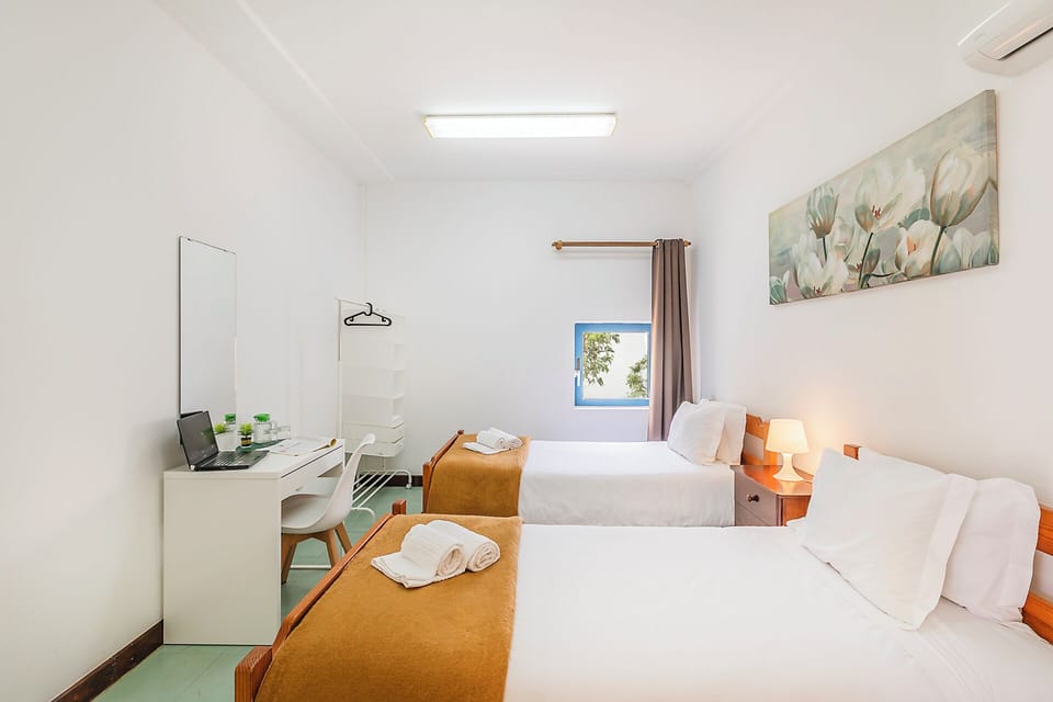 Twin Room, Shared Bathroom | Iron/ironing board, free WiFi